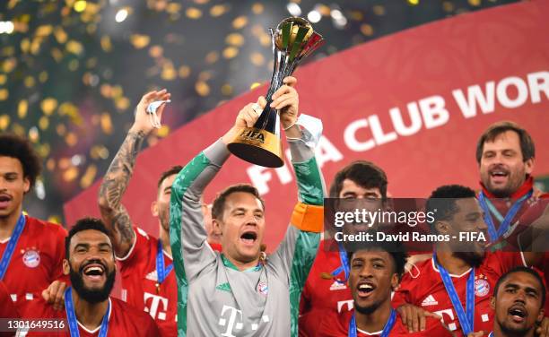 Manuel Neuer of FC Bayern Muenchen lifts the FIFA Club World Cup Qatar 2020 trophy as FC Bayern Muenchen celebrate after winning the FIFA Club World...