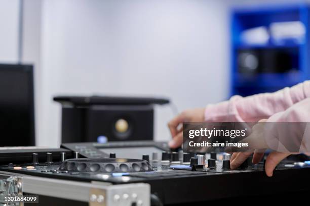 dj working with a professional sound mixer console. - dj console stock pictures, royalty-free photos & images