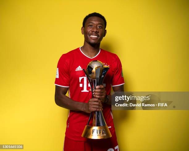 David Alaba of FC Bayern Muenchen poses with the trophy after winning the FIFA Club World Cup Qatar 2020 Final between FC Bayern Muenchen and Tigres...