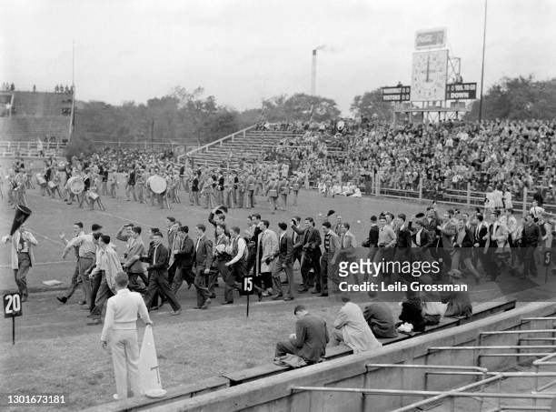 Crowd rushes the field at a Vanderbilt University home game circa 1940 in Nashville, Tennessee.