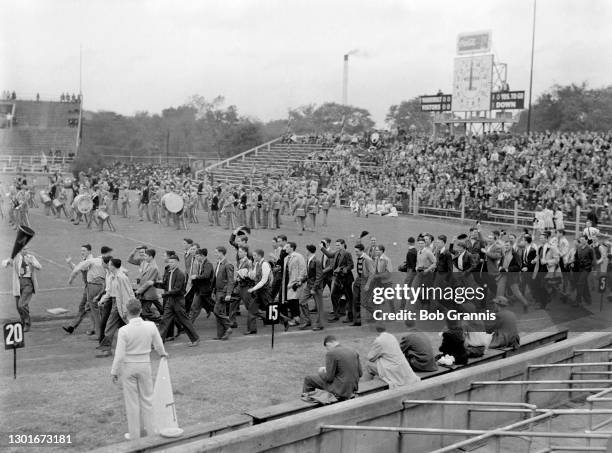 A crowd rushes the field at a Vanderbilt University home game circa ...