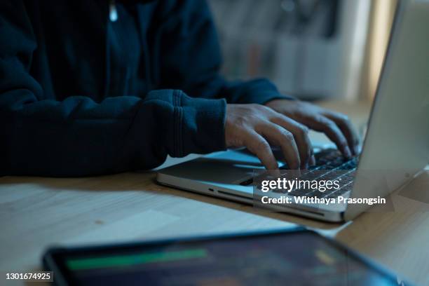 close up programmer man hand typing on keyboard laptop for register data system or access password at dark operation room , cyber security concept - phishing stock pictures, royalty-free photos & images