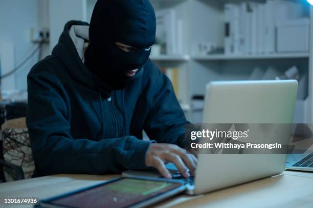 hacker is using computer - data breach stock pictures, royalty-free photos & images