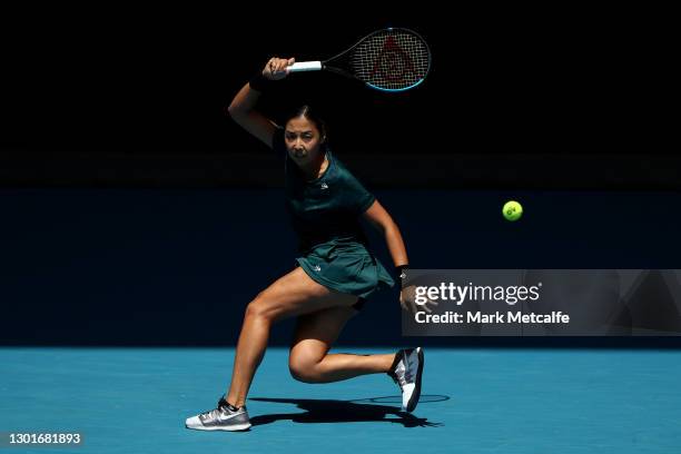 Zarina Diyas of Kazakhstan plays a forehand in her Women's Singles third round match against Garbine Muguruza of Spain during day five of the 2021...