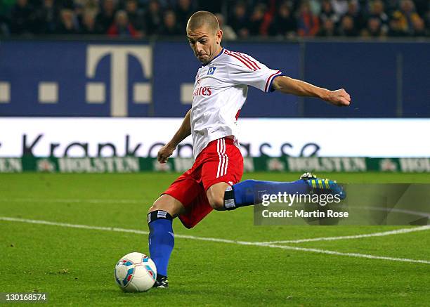 Mladen Petric of Hamburg runs with the ball during the Bundesliga match between Hamburger SV and VfL Wolfsburg at Imtech Arena on October 22, 2011 in...