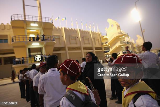 Young fans arrive at Al Gharafa Stadium to watch the Gharafa vs. Kharaitiyat Qatar Stars League football match on October 23, 2011 in Doha, Qatar....