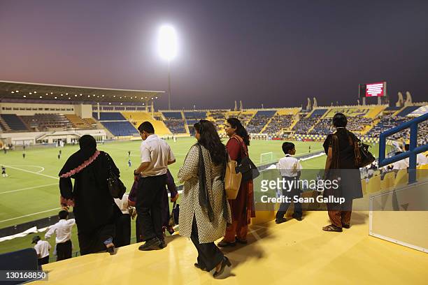 Fans arrive at Al Gharafa Stadium to watch the Gharafa vs. Kharaitiyat Qatar Stars League football match on October 23, 2011 in Doha, Qatar. Qatar...
