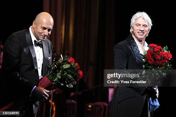 Russian composer Igor Krutoy and opera singer Dimitri Hvorostovsky greet people after the Style.Uz Art Week 2011 concert at Istiqlol Palace on...