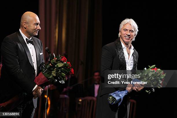Russian composer Igor Krutoy and opera singer Dimitri Hvorostovsky greet people after the Style.Uz Art Week 2011 concert at Istiqlol Palace on...