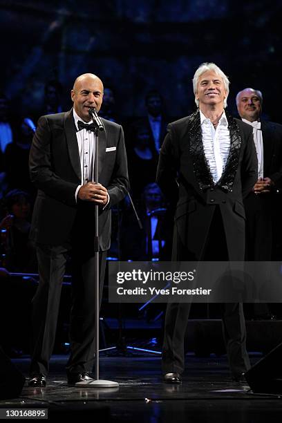 Russian composer Igor Krutoy and opera singer Dimitri Hvorostovsky greet people after the Style.Uz Art Week 2011 concert at Istiqlol Palace on...