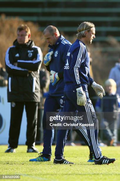 Goalkeeper coach Bernd Dreher, Mathias Schober and Timo Hildebrand attend the FC Schalke training session at the training ground at Veltins Arena on...