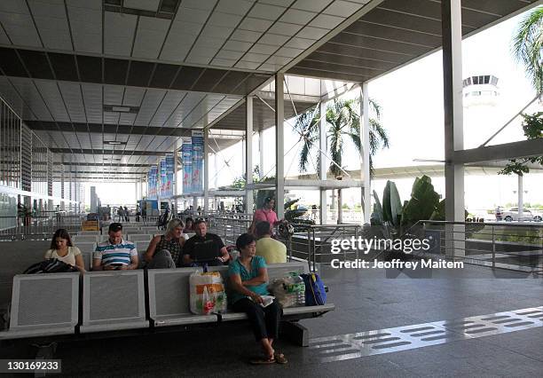 Passengers waiting for their flights are seen at the Ninoy Aquino International Airport on October 24, 2011 in Manila, Philippines. The NAIA in...