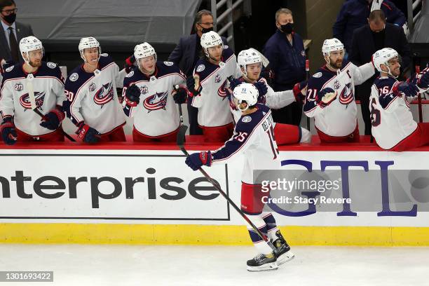 Michael Del Zotto of the Columbus Blue Jackets celebrates with teammates after scoring a goal during the third period against the Chicago Blackhawks...