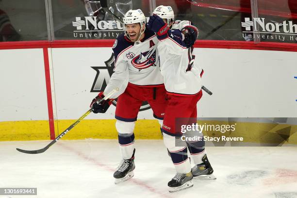 Michael Del Zotto of the Columbus Blue Jackets celebrates with Boone Jenner after scoring a goal during the third period against the Chicago...