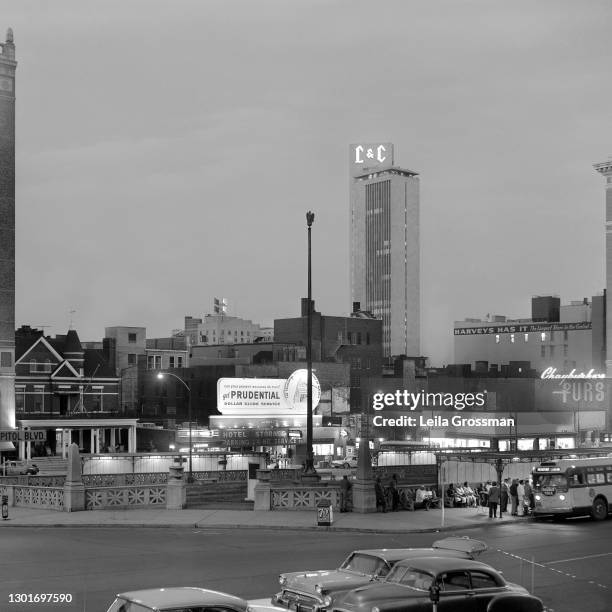 An evening view of the bus stop at legislative plaza with the L&C tower and Prudential insurance sign in background a circa 1960 in downtown...