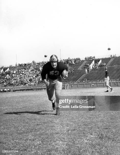 Vanderbilt University football player running with a football circa 1940 in Nashville, Tennessee.