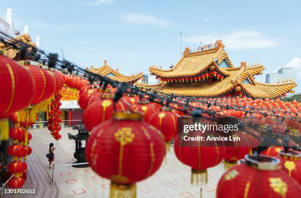 Woman holds joss sticks as she prays on the first day of Lunar New Year at Thean Hou Temple on February 12, 2021 in Kuala Lumpur, Malaysia. The...