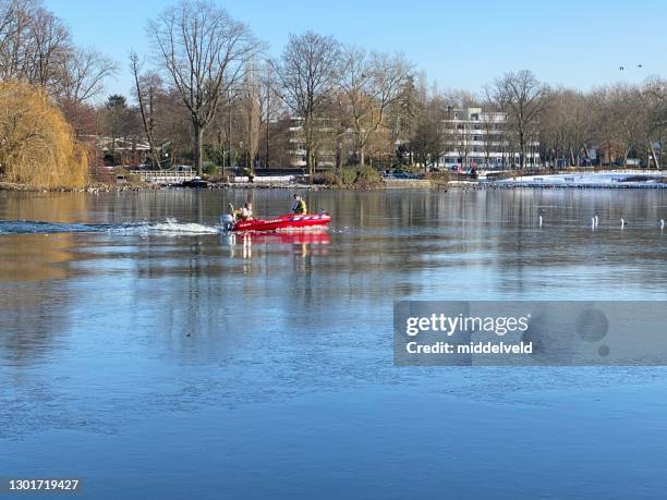 fire brigade in winter rescue action - frozen let it go stock pictures, royalty-free photos & images