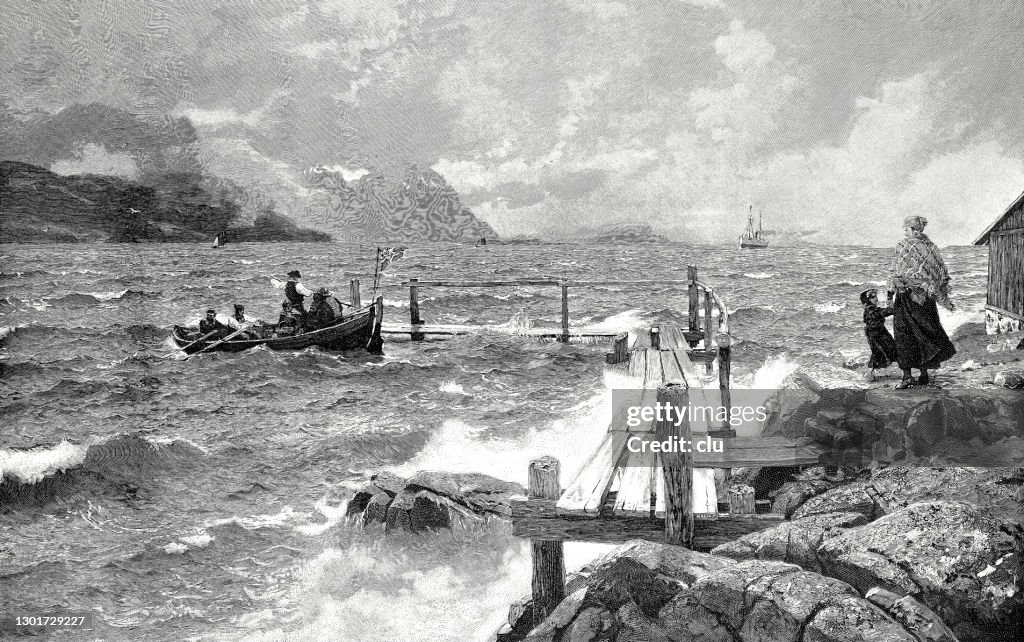 Norway fjord, a boat arriving at the jetty