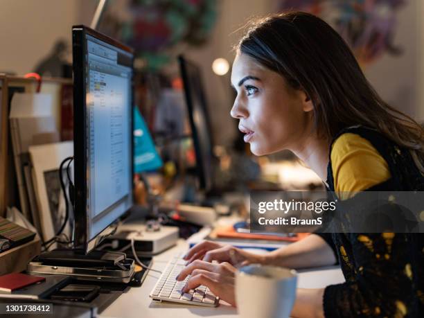 female programmer staring at computer monitor while working in the office. - staring at screen stock pictures, royalty-free photos & images