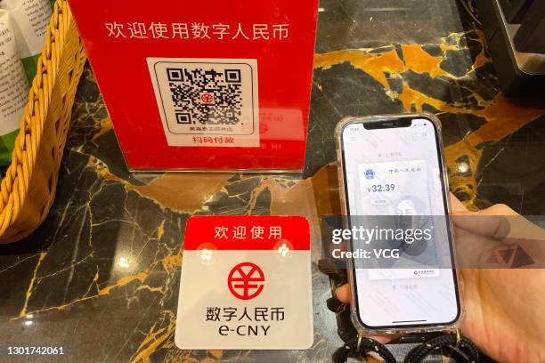 Customer makes a payment using China's digital currency, or e-CNY, at Wangfujing Department Store on February 11, 2021 in Beijing, China.