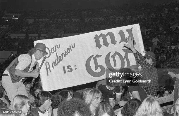 Jethro Tull fans raise a banner reading 'Ian Anderson is my God' in the audience at a concert by British rock band Jethro Tull, location unspecified,...