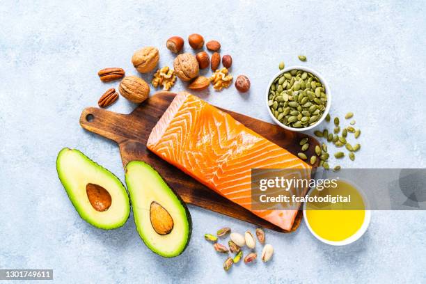 food with high content of healthy fats. overhead view. - salmon seafood stock pictures, royalty-free photos & images