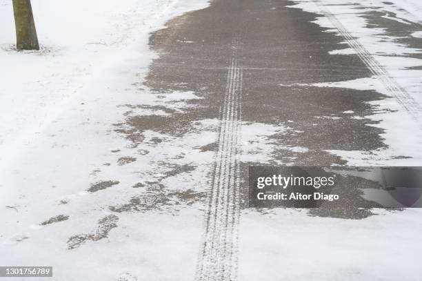 iced asphalt of a road. germany - snow squall stock pictures, royalty-free photos & images