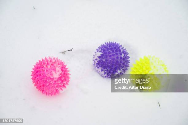 close- up of three different kinds of iced coronavirus on the snow. does the iced temperature affects the covid-19? - hospital acquired infection stock pictures, royalty-free photos & images