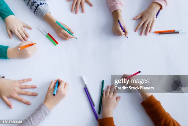 children hands drawing on white paper - kids background stock pictures, royalty-free photos & images