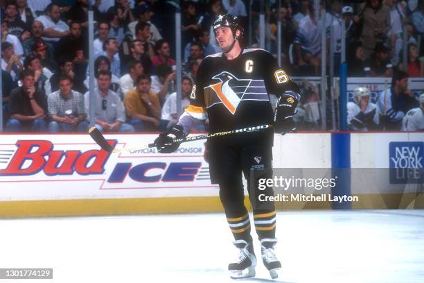 Mario Lemieux of the Pittsburgh Penguins looks on during a during a hockey game against the Washington Capitals on November 1, 1996 at USAir Arena in...