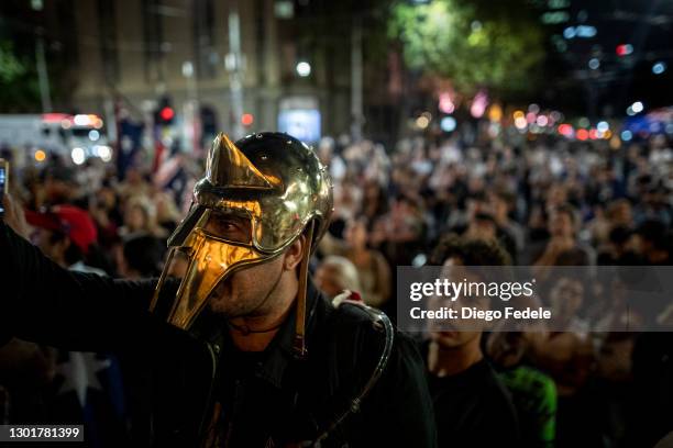 Anti lockdown protester is seen wearing a spartan helmet in front of Parliament House, following the announcement of the lockdown on February 12,...