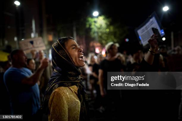 Anti lockdown protester is seen shouting against the lockdown at Parliament House, following the announcement of the lockdown on February 12, 2021 in...