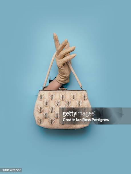 woman's gloved hand holding purse - vintage handbag stock pictures, royalty-free photos & images
