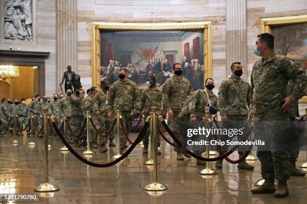 Soldiers with the National Guard tour the Rotunda of the U.S. Capitol during the fourth day of former President Donald Trump's impeachment trial on...