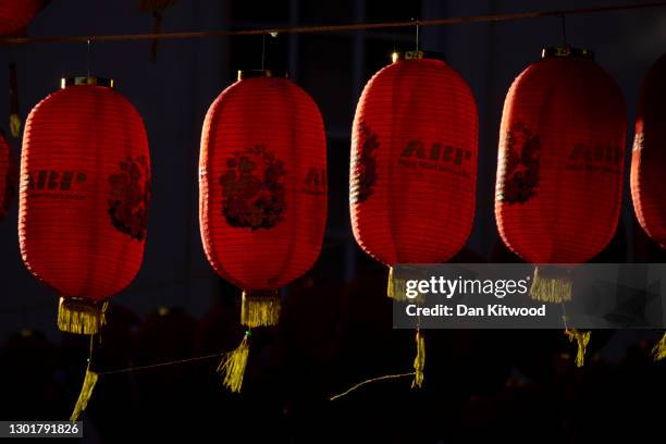 Chinese lanterns hang in Chinatown on February 12, 2021 in London, England. This year's festivities, which usher in the Year of the Ox, take place...