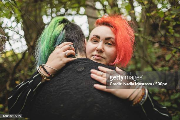 Goth transgender couple spending time together outdoors,Poulsbo,Washington,United States,USA