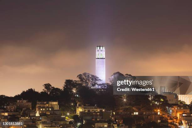 illuminated coit tower at night in san francisco, california, usa - san francisco financial district stock pictures, royalty-free photos & images