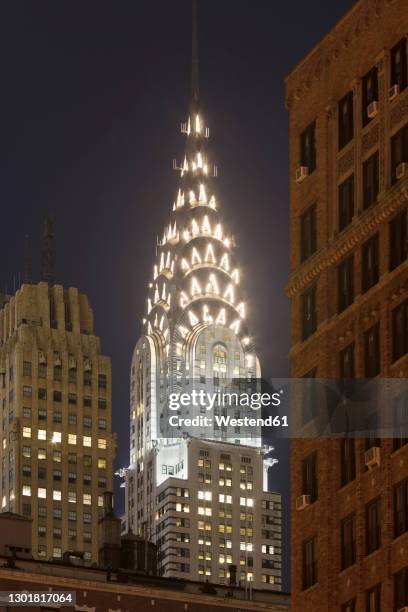 usa, new york, new york city, chrysler building illuminated at night - chrysler building stock pictures, royalty-free photos & images