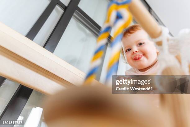 baby girl playing at home - funny face baby stock pictures, royalty-free photos & images