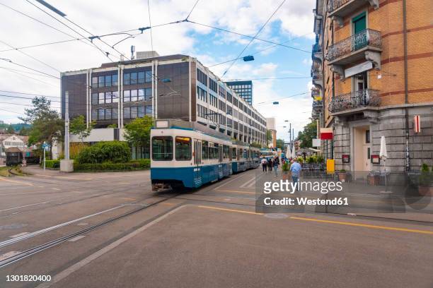 switzerland, zurich, tram and buildings at escher wyss square - zurich stock-fotos und bilder