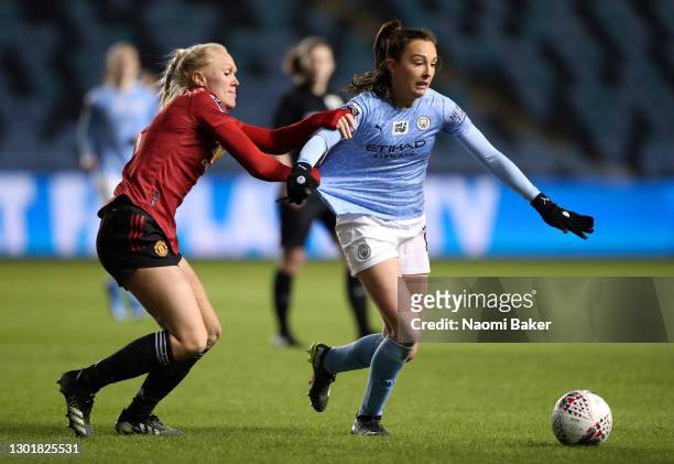 Maria Thorisdottir of Manchester United battles for possession with Caroline Weir of Manchester City during the Barclays FA Women's Super League...