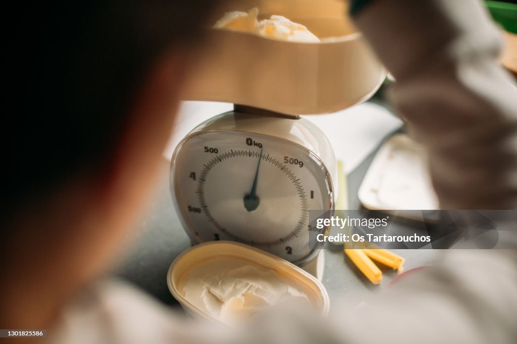 Weighting butter on an analog kitchen scale