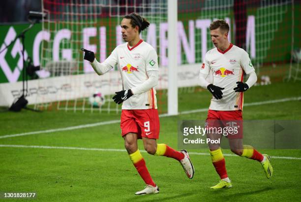 Yussuf Poulsen and Dani Olmo of RB Leipzig celebrate their team's second goal scored by Christopher Nkunku during the Bundesliga match between RB...