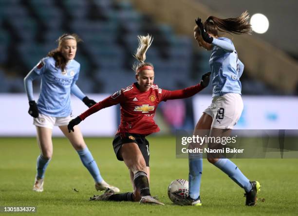 Jackie Groenen of Manchester United tackles Caroline Weir of Manchester City during the Barclays FA Women's Super League match between Manchester...