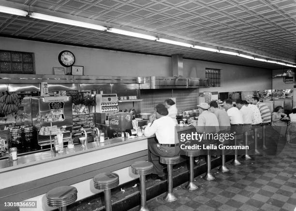 View of people eating at a lunch counter circa 1950 in downtown Nashville, Tennessee.
