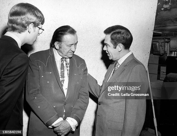 Country singer and actor Tex Ritter, father of John Ritter, being interviewed backstage at the Grand Ole Opry circa 1970 in Nashville, Tennessee.