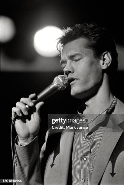 Randy Bruce Traywick, better known as Randy Travis, performs at the Cheyenne Frontier Days rodeo grounds on July, 1987 in Cheyenne, Wyoming. A...