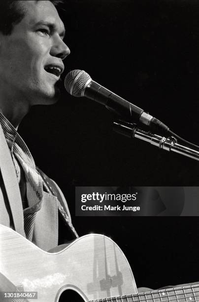 Randy Bruce Traywick, better known as Randy Travis, performs at the Cheyenne Frontier Days rodeo grounds on July, 1987 in Cheyenne, Wyoming. A...