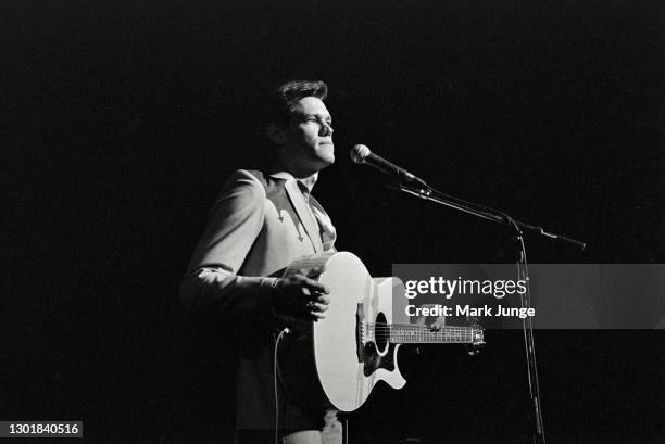 Randy Bruce Traywick, better known as Randy Travis, performs at the Cheyenne Frontier Days rodeo grounds on July, 1987 in Cheyenne, Wyoming. A...